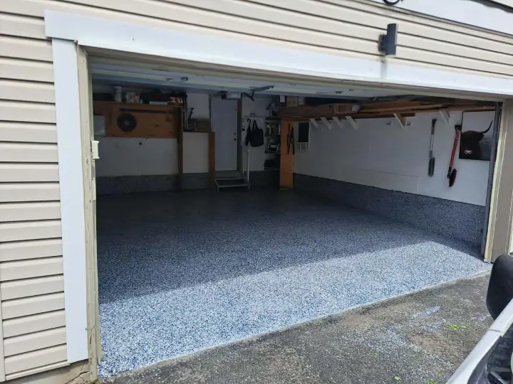 Finished residential garage floor viewed from the driveway
